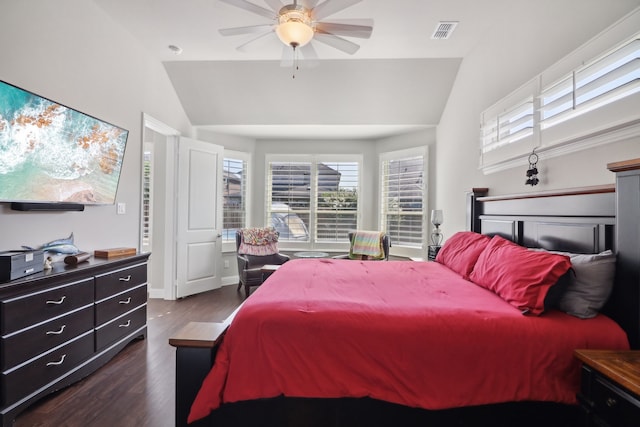 bedroom with ceiling fan, dark hardwood / wood-style flooring, and vaulted ceiling