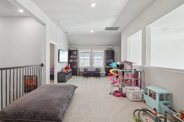 interior space with lofted ceiling and light carpet