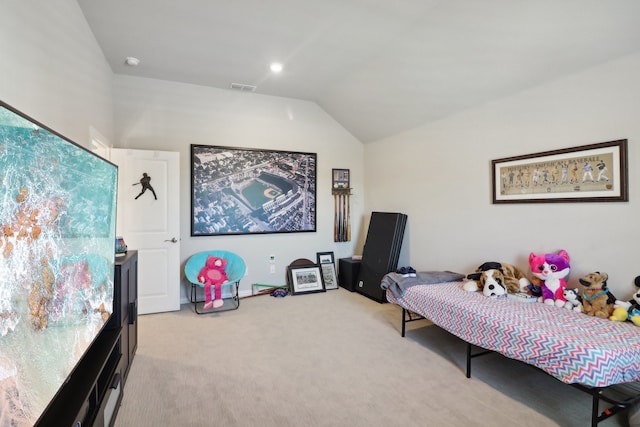 carpeted bedroom featuring vaulted ceiling