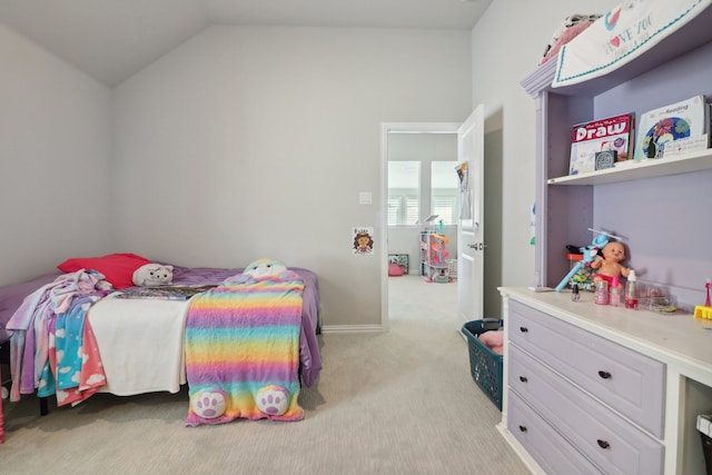 carpeted bedroom with lofted ceiling