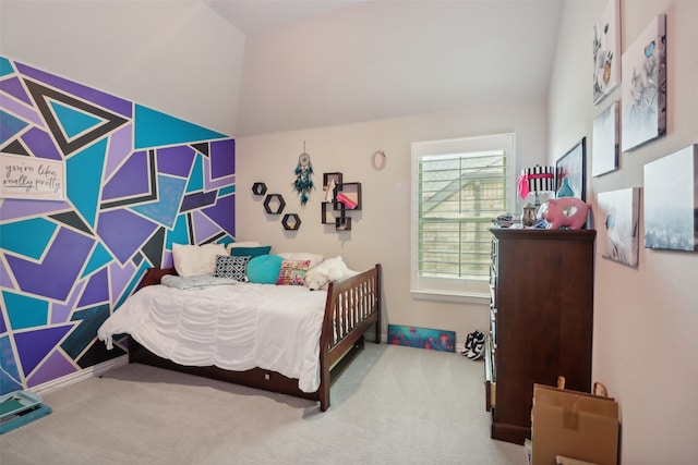 bedroom with vaulted ceiling and carpet floors