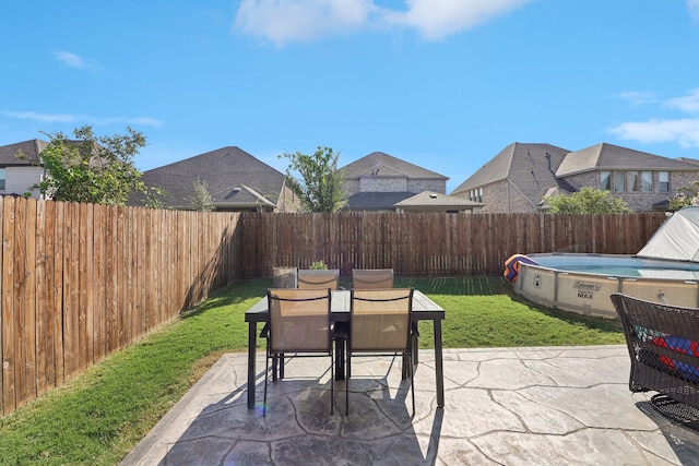 view of patio / terrace featuring a covered pool