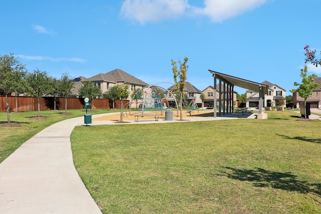 surrounding community featuring a playground and a yard