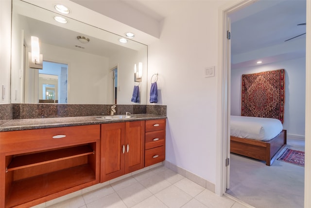 bathroom featuring tile patterned floors and vanity