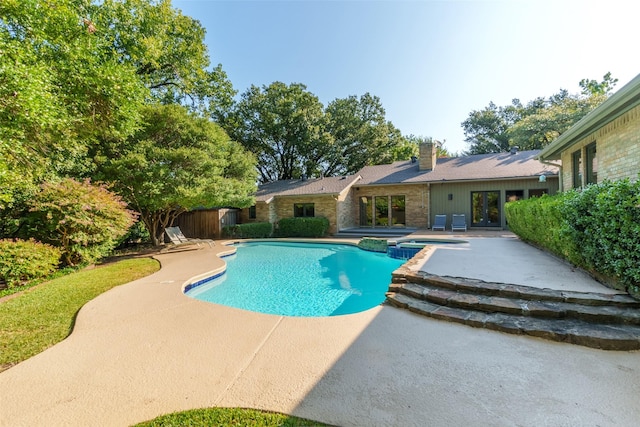 10807 Dove Brook Cir, Dallas, TX 75230 - view of swimming pool featuring a patio and a pool with connected hot tub
