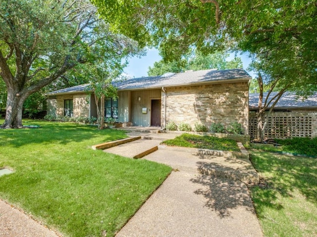 10807 Dove Brook Cir, Dallas, TX 75230 - view of front of home featuring a front lawn and brick siding