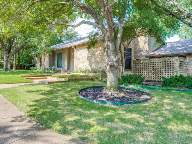10807 Dove Brook Cir, Dallas, TX 75230 - view of front of house featuring brick siding and a front yard
