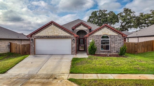 single story home with a front lawn and a garage