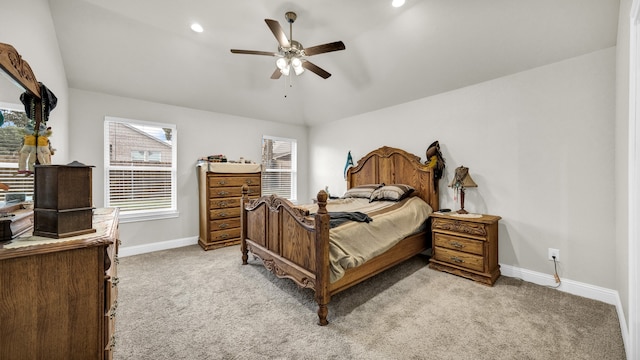 carpeted bedroom with lofted ceiling, multiple windows, and ceiling fan