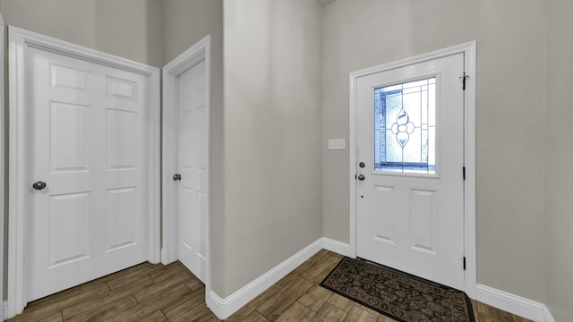 foyer with dark hardwood / wood-style floors