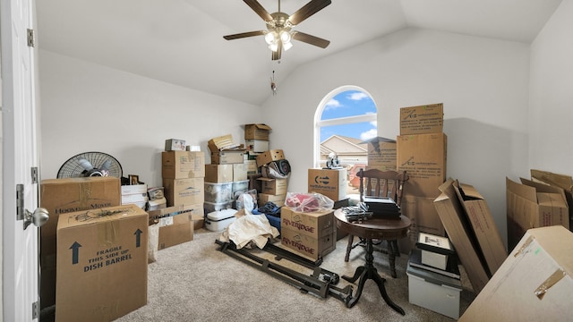 misc room with lofted ceiling, carpet, and ceiling fan