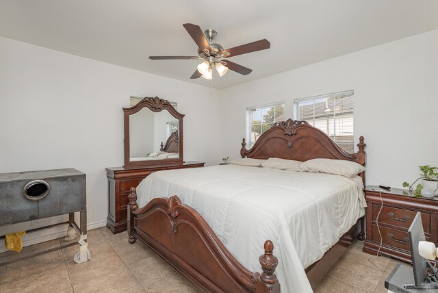 bedroom featuring ceiling fan and light tile patterned floors