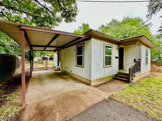 exterior space with a carport