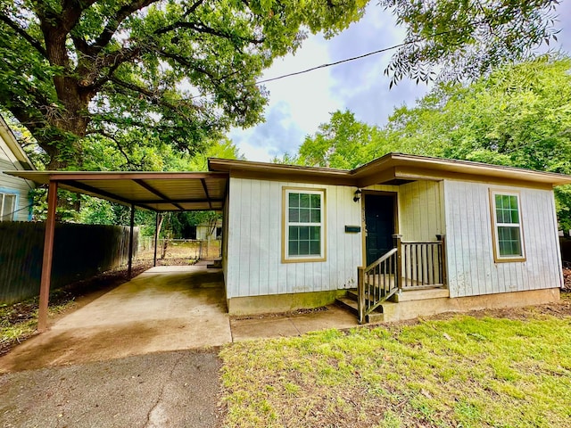 view of front of house with a carport