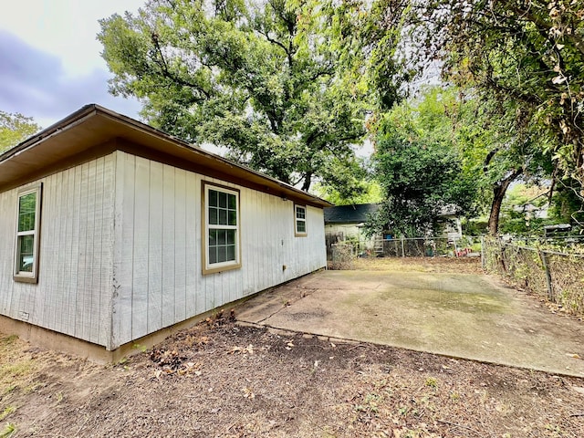 view of side of home featuring a patio