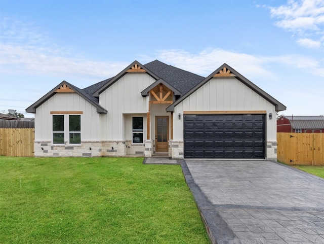 modern farmhouse style home featuring a garage and a front lawn