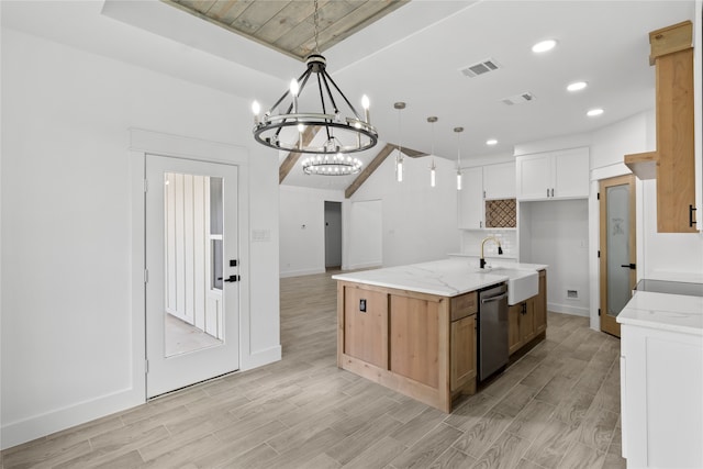 kitchen with decorative light fixtures, sink, white cabinetry, and light hardwood / wood-style flooring