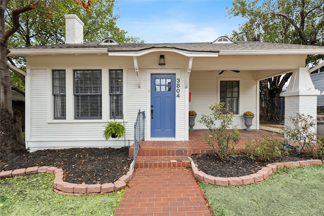 entrance to property featuring a porch