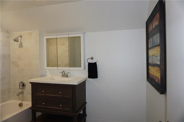 bathroom with vanity and tiled shower / bath combo