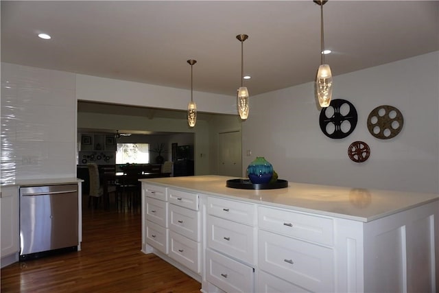 kitchen featuring hanging light fixtures, dishwasher, dark hardwood / wood-style flooring, and white cabinetry