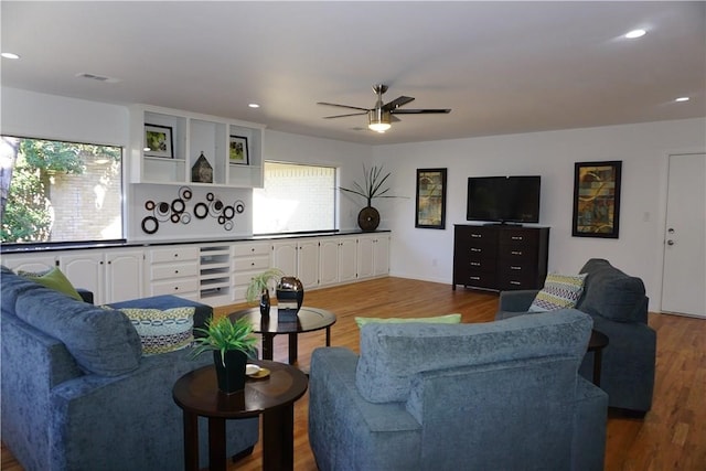 living room with ceiling fan and hardwood / wood-style floors