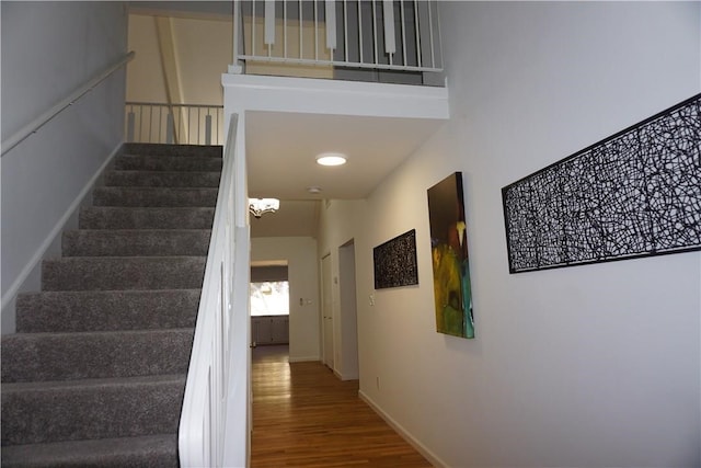 stairway featuring hardwood / wood-style flooring