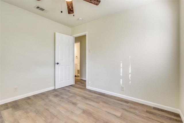 spare room featuring ceiling fan and light hardwood / wood-style flooring