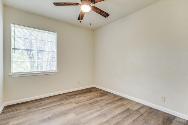 empty room featuring ceiling fan and light hardwood / wood-style floors