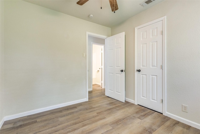 unfurnished bedroom featuring light hardwood / wood-style floors and ceiling fan