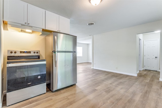 kitchen with a textured ceiling, stainless steel appliances, white cabinetry, and light hardwood / wood-style floors