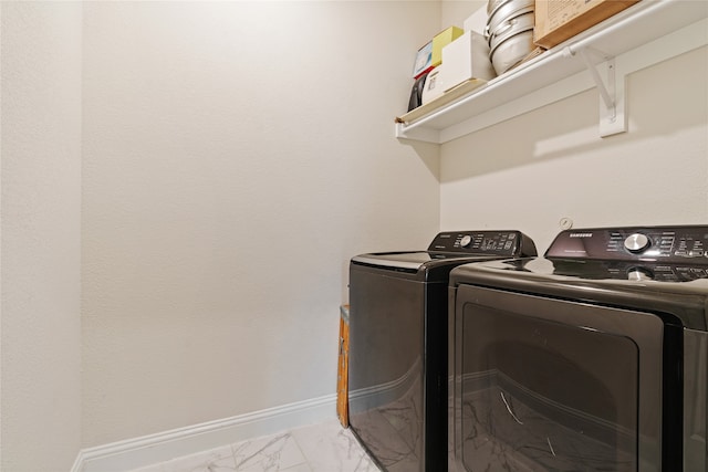 laundry room featuring separate washer and dryer