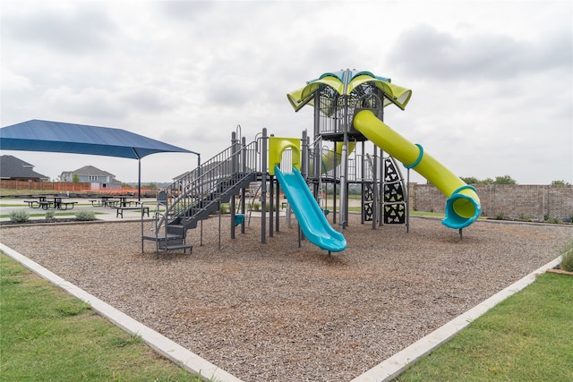 view of jungle gym featuring a lawn