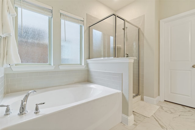 bathroom with shower with separate bathtub