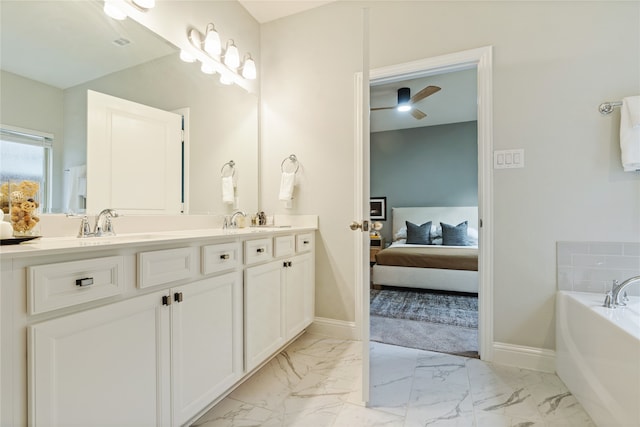 bathroom featuring vanity, a bathing tub, and ceiling fan