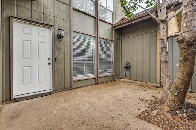 property entrance with a patio area