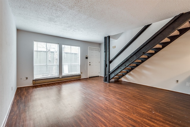 unfurnished living room featuring a baseboard radiator, dark hardwood / wood-style floors, and a textured ceiling