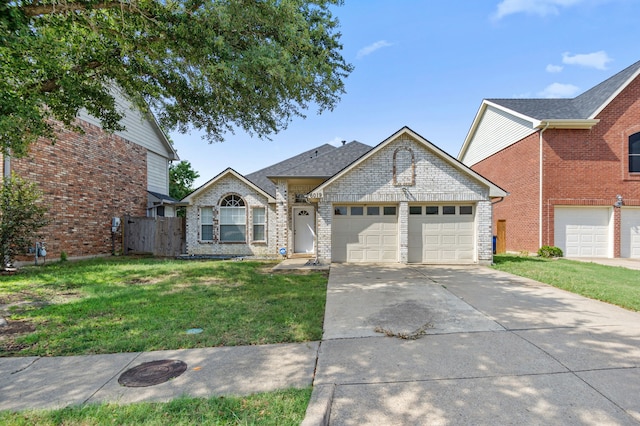 view of front of home with a front yard, an attached garage, brick siding, and driveway