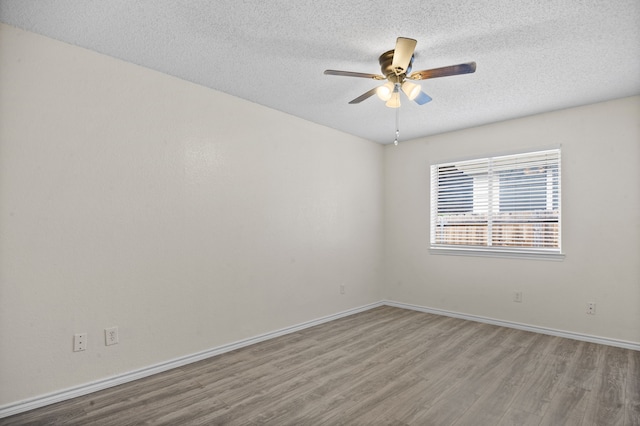 unfurnished room featuring a textured ceiling, ceiling fan, and hardwood / wood-style flooring