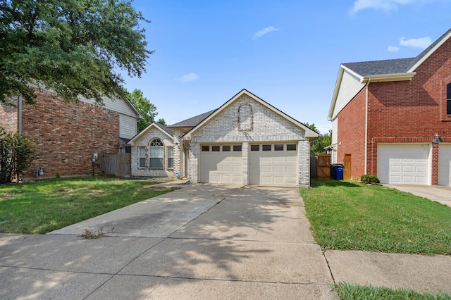 view of front facade with a front yard and a garage