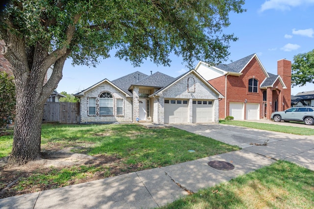 view of front of property featuring a garage and a front yard