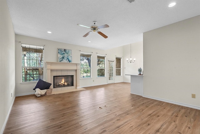 unfurnished living room with hardwood / wood-style flooring and a wealth of natural light