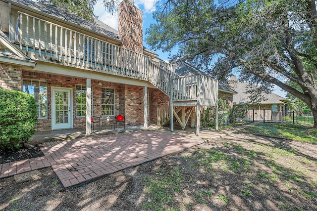 back of property featuring a patio area