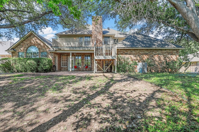 back of property with a patio