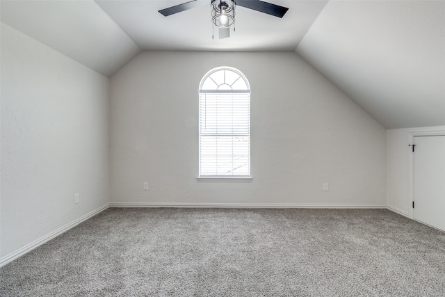 bonus room with lofted ceiling, ceiling fan, and carpet