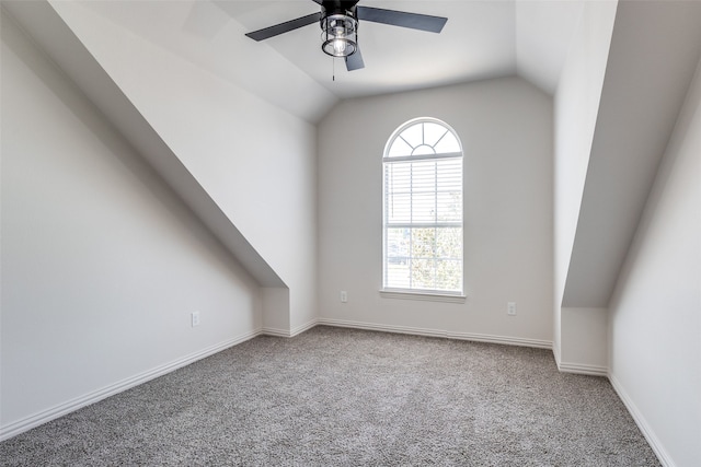 additional living space featuring carpet flooring, ceiling fan, a wealth of natural light, and vaulted ceiling