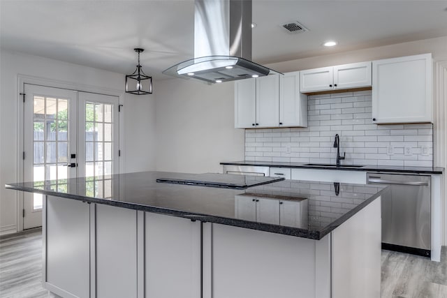 kitchen featuring stainless steel dishwasher, a kitchen island, island exhaust hood, and sink