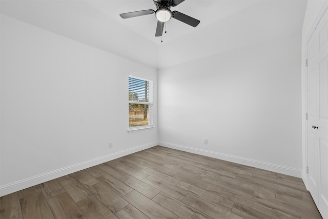 spare room featuring ceiling fan and light hardwood / wood-style flooring