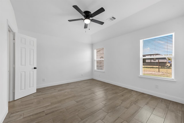 empty room featuring ceiling fan and light wood-type flooring