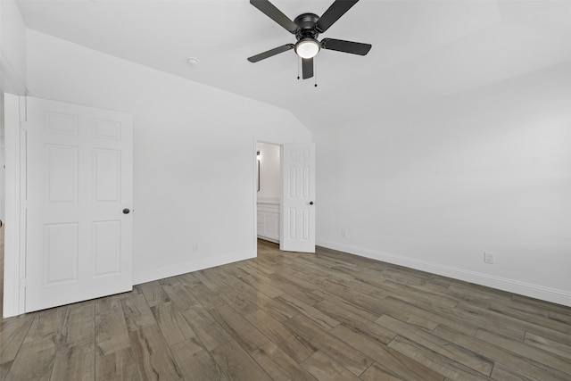 unfurnished bedroom featuring dark wood-type flooring and ceiling fan