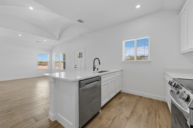 kitchen with stainless steel appliances, light hardwood / wood-style floors, white cabinetry, and sink